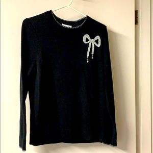 Woman’s Black and Silver Sweater.